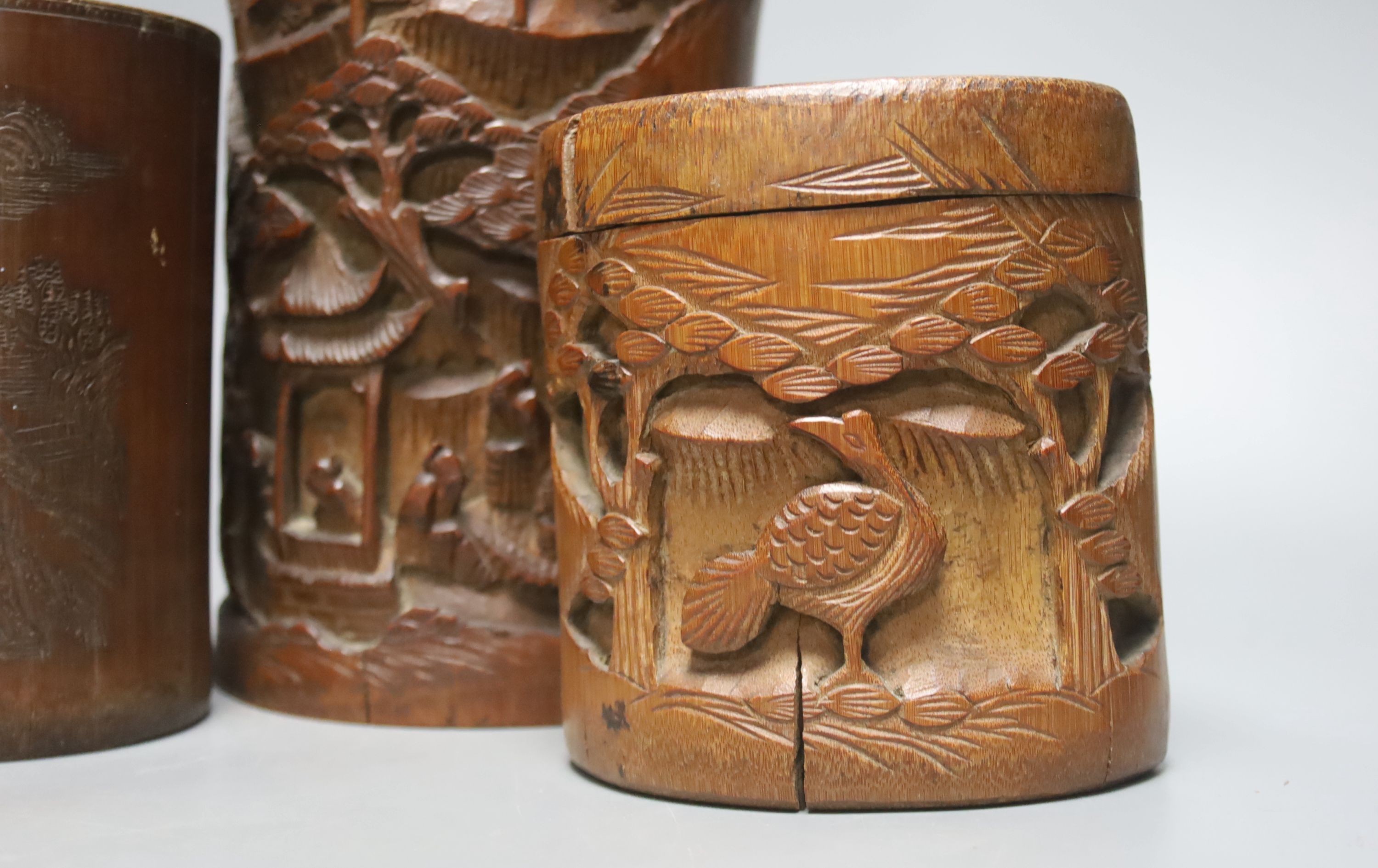 Four Chinese bamboo brushpots and a caddy, tallest brush pot 29 cms high.